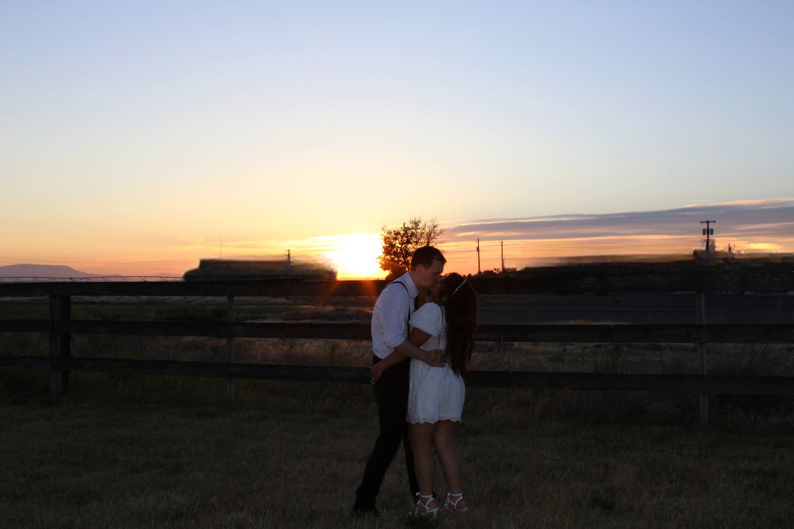 couple enjoying a golden hour kiss at their Stone Ridge Estates wedding venue Pasco, washington