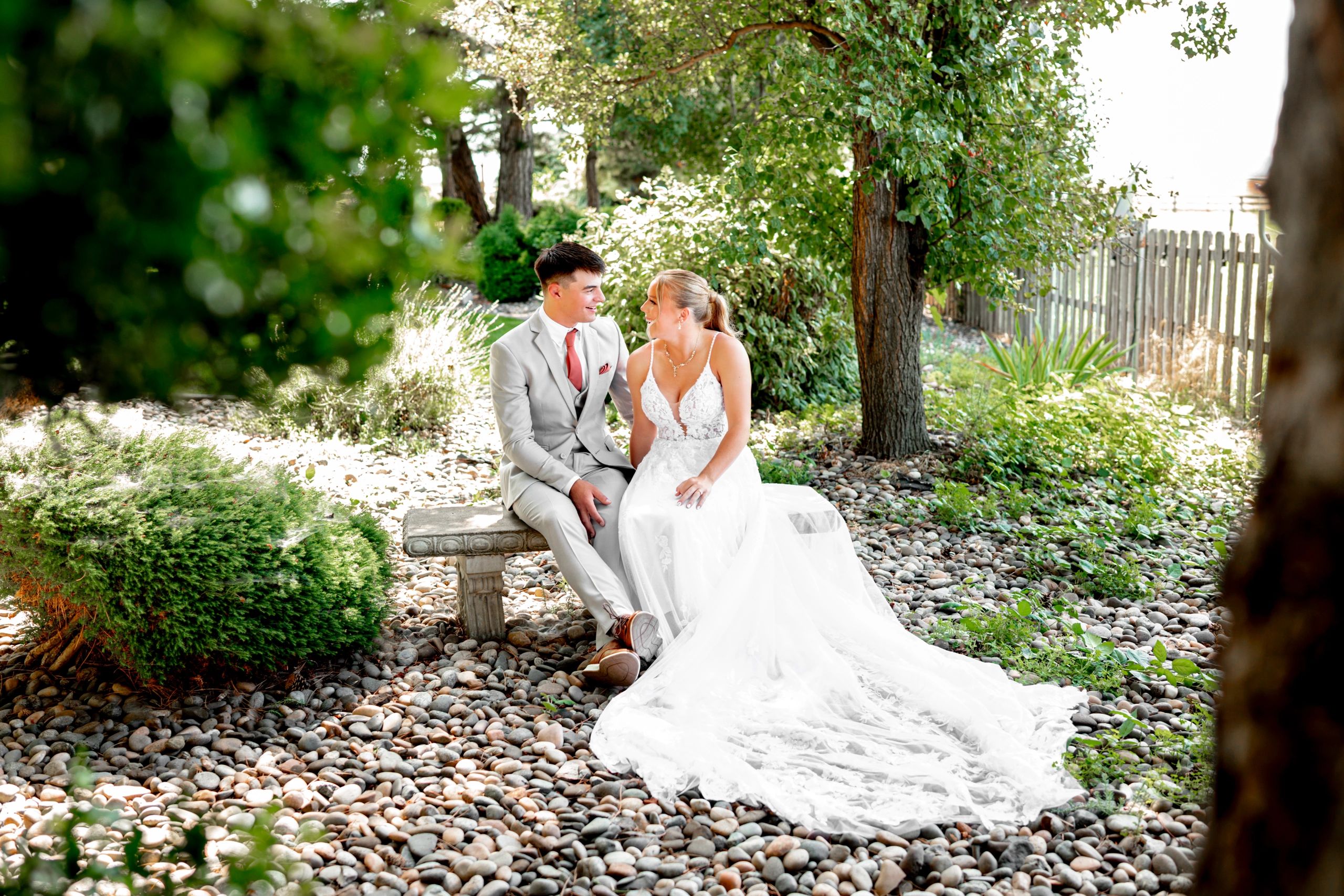 bride wearing a wedding dress in rustic barn wedding venue gardens in tri-cities