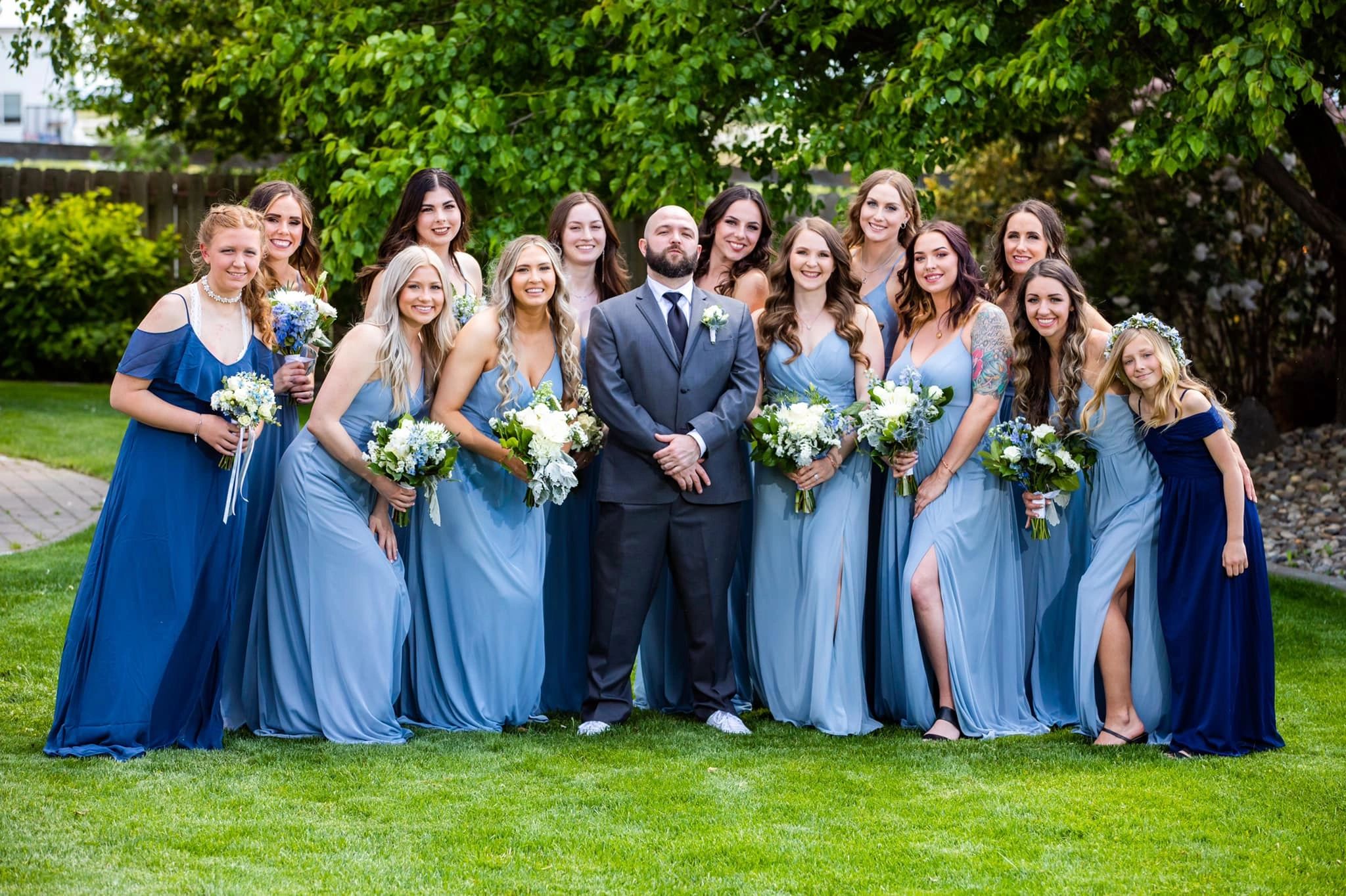 Country wedding venue. Barn wedding venue. Pasco wedding venue. Tri-Cities wedding venue.Groom With Bridesmaids in Stone Ridge Estates Wedding Venue Garden.