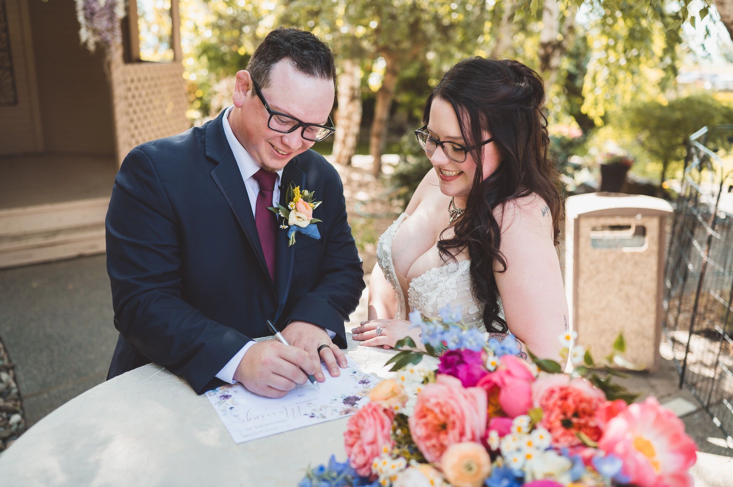 wedding couple just married at stone ridge estates wedding venue in pasco wa in the country wedding venue signing marriage license