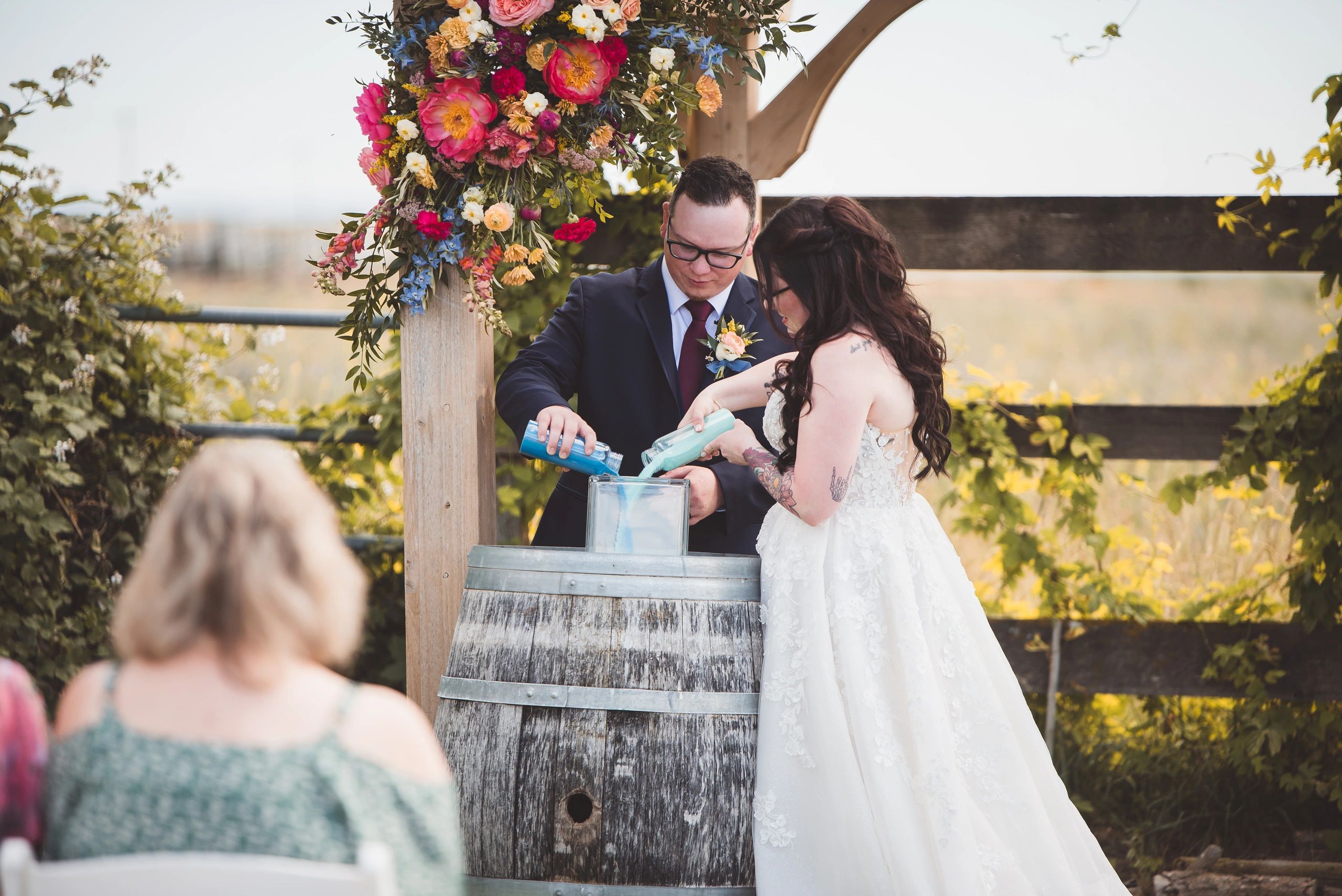 wedding couple just married at stone ridge estates wedding venue in pasco wa in the country doing a sand ceremony