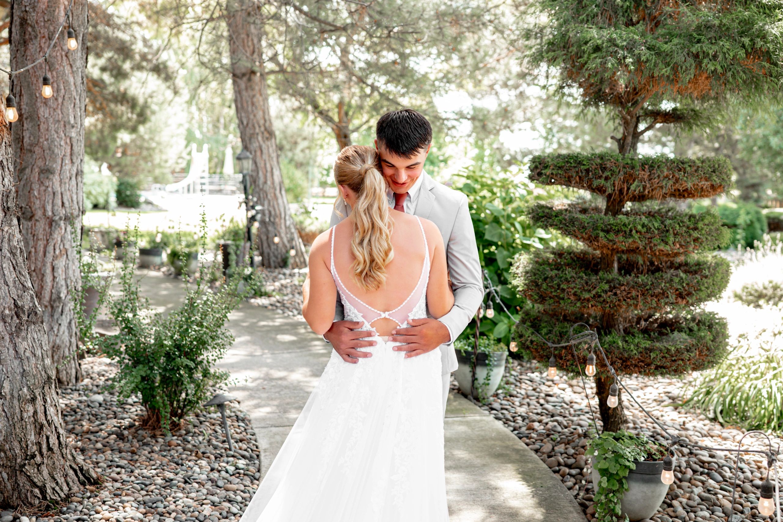 Couple embracing in gardens at Stone Ridge Estates Wedding Venue Tri-Cities, WA