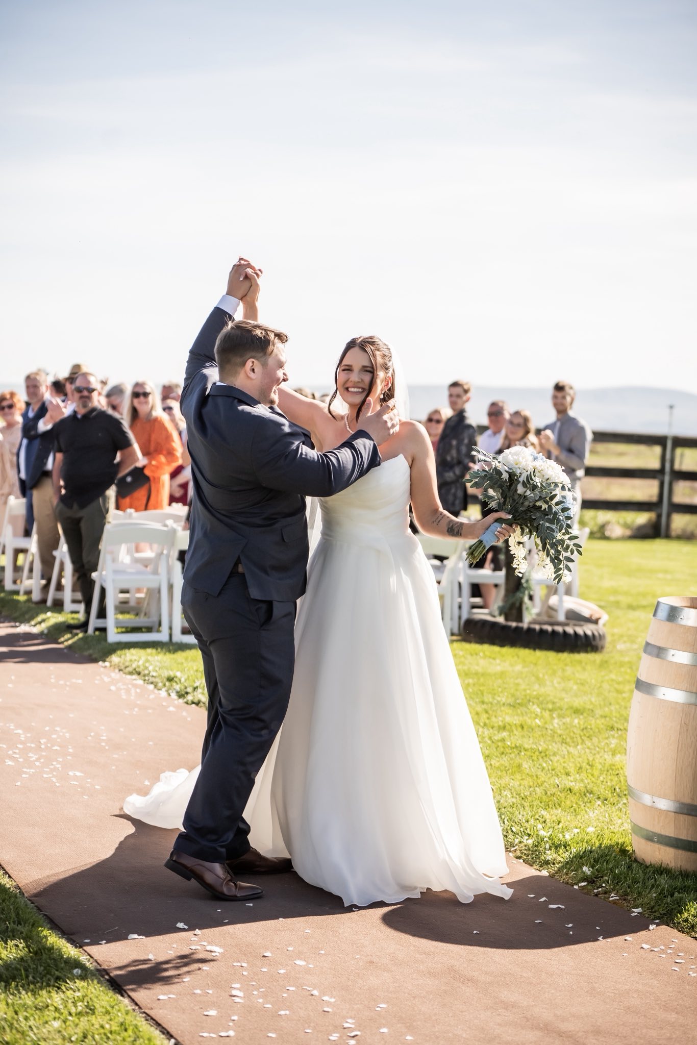 Newlyweds celebrating together after their Stone Ridge Estates ceremony