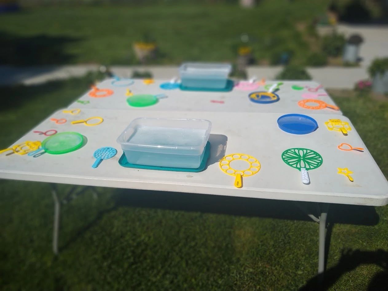 Children enjoying outdoor activities during the Mommy and Me Tea Party