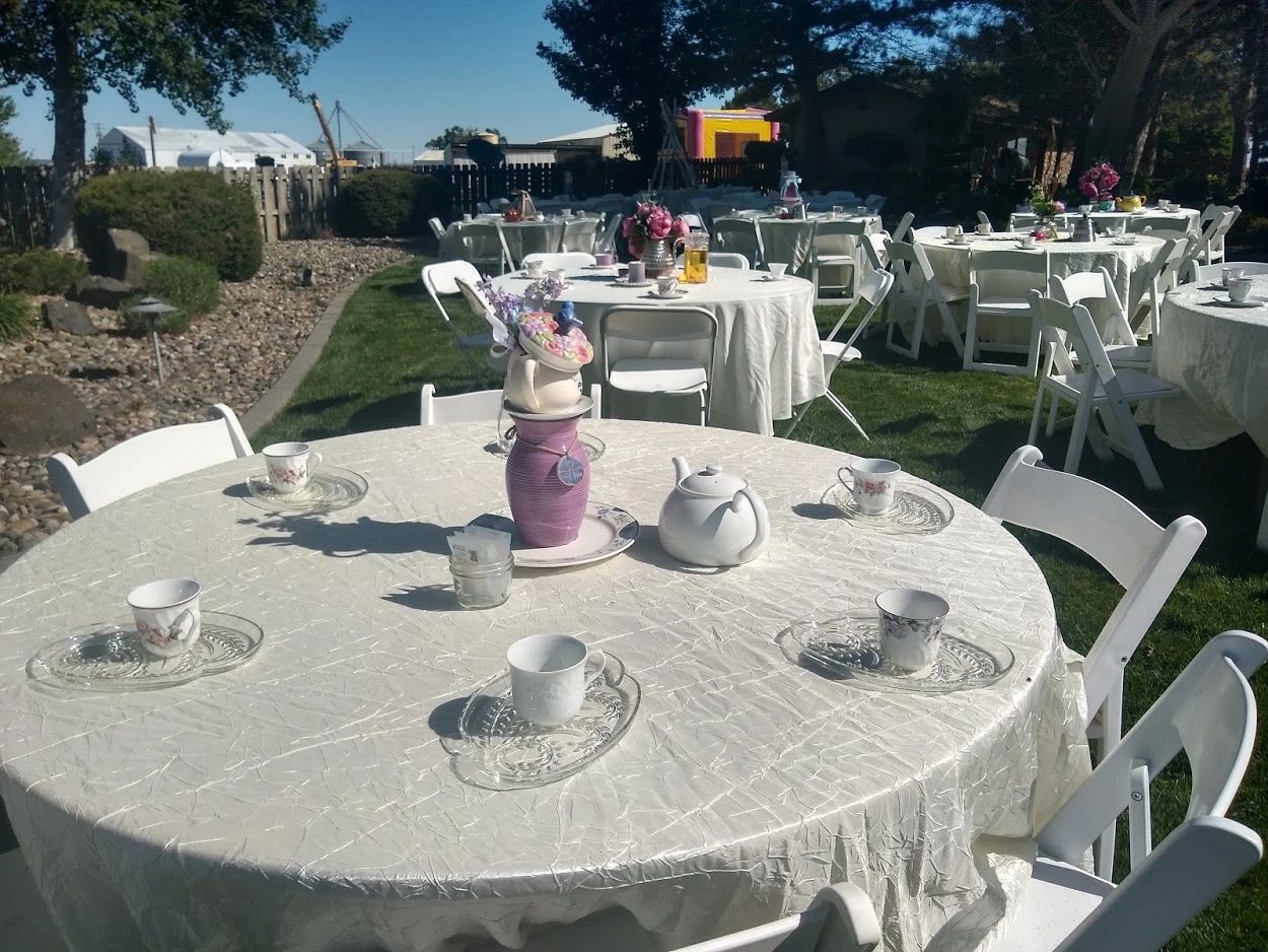 Tea Party tables decorated with china and floral centerpieces