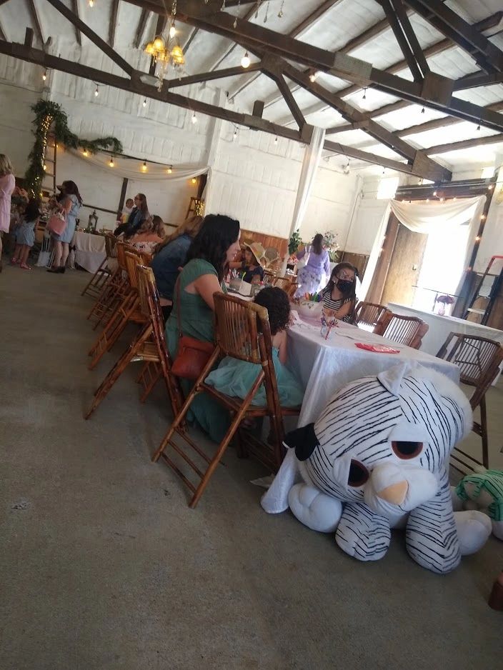 Families enjoying activities together at the Stone Ridge Tea Party
